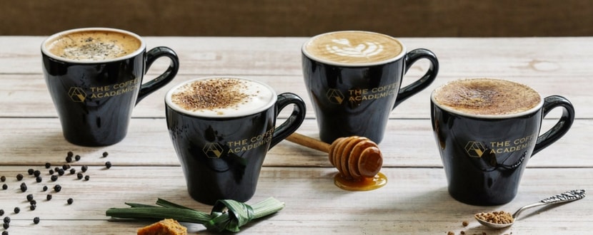 4 cups of coffee placed on a - SingSaver
